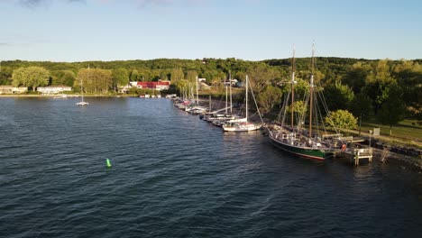 Cozy-town-with-small-pier-of-Suttons-Bay,-aerial-drone-view