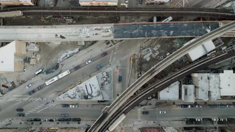 Fixed-aerial-view-above-of-a-trains-on-a-elevated-rails,-in-Chicago,-USA---cenital,-drone-shot