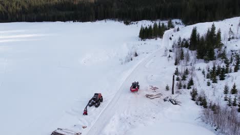 Tractor-cleaning-the-snow-on-a-forest-road