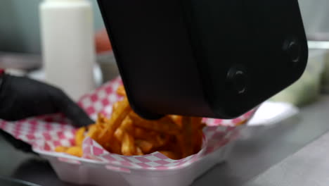 Dumping-French-fries-in-to-a-serving-basket---food-truck-series