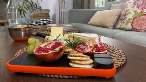 Beautiful-Cheese-Plate-With-Exotic-Fruit-on-Couch-Table