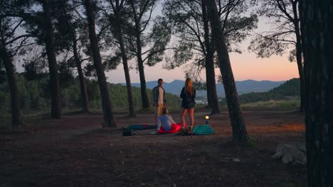 Friends-wake-up-after-camping-in-a-forest