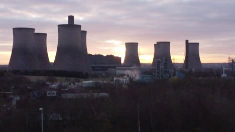Aerial-view-across-Fiddlers-Ferry-disused-coal-fired-power-station-with-sunrise-behind-landmark