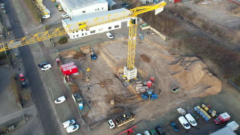 a-large-yellow-construction-crane-and-various-construction-machines-are-used-on-a-construction-site
