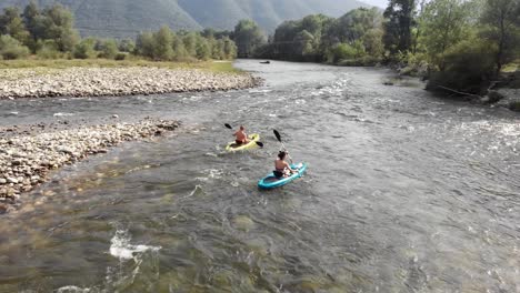 Drone-video-following-two-people-kayak-Nestos-river-Greece-panning-right-summer
