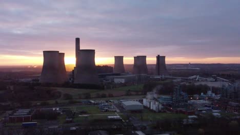 Fiddlers-Ferry-disused-coal-fired-power-station-during-sunrise,-Aerial-view-rising-across-Warrington-landmark