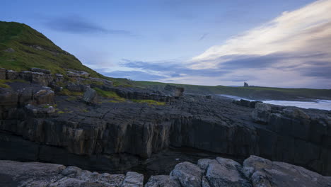 Timelapse-of-rugged-coastline-cliffs-with-moving-clouds-and-Classiebawn-castle-in-distance-in-Mullaghmore-Head-in-county-Sligo-on-the-Wild-Atlantic-Way-in-Ireland