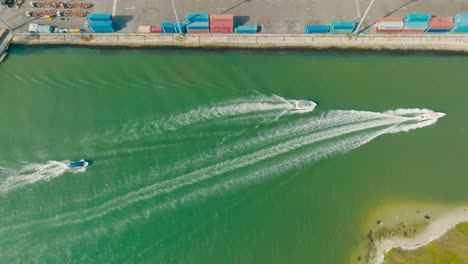 Aerial-top-down-Drone-shot-of-boats-Passing-the-port,-Colombia-Cartagena