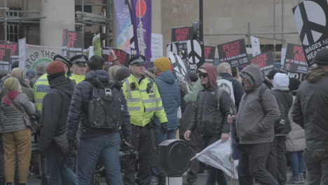 Police-Officers-with-Gathering-Crowds-in-Central-London-for-the-Stop-the-War-in-Ukraine-Rally-on-February-25th-2023,-No-to-War,-No-to-NATO-demonstration
