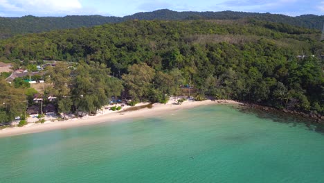 Magic-aerial-view-flight-at-white-beach-koh-kood-island-in-thailand,-sunny-day-2022