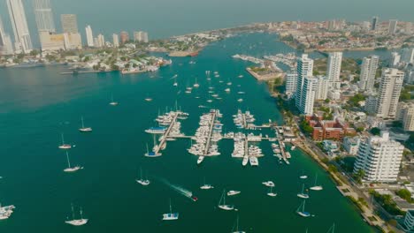 Aerial-Shot-of-a-lot-of-boats-sailing-to-the-ocean-in-the-parking-boat,-Marina,-Cartagena,-Colombia