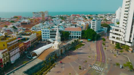 Aerial-drone-shot-of-the-Walled-City-of-Cartagena-entrance,-clock-tower,-Colombia