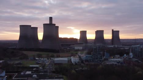 Aerial-view-across-Fiddlers-Ferry-disused-coal-fired-power-station-with-sunrise-behind-Warrington-landmark