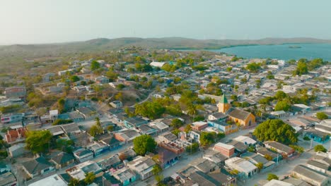 Aerial-Drone-shot-of-a-coast-town-near-the-sea-in-Colombia,-Cartagena
