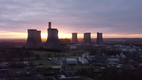Fiddlers-Ferry-disused-coal-fired-power-station-during-golden-hour,-Aerial-view-rising-across-Warrington-landmark