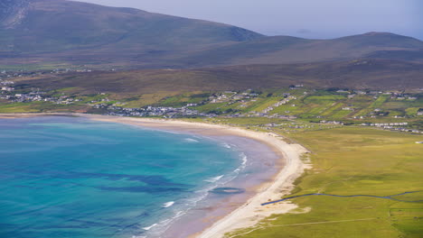 Timelapse-of-seaside-village-grass-and-lake-hillside-landscape-with-local-sand-beach-and-clouds-casting-shadows-in-daylight-viewed-from-Minaugn-Heights-in-Achill-Island-in-county-Mayo-in-Ireland