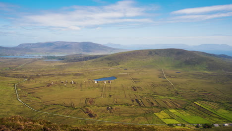 Timelapse-of-remote-village-bogland-and-lake-hillside-landscape-with-clouds-casting-shadows-in-daylight-viewed-from-Minaugn-Heights-in-Achill-Island-in-county-Mayo-in-Ireland