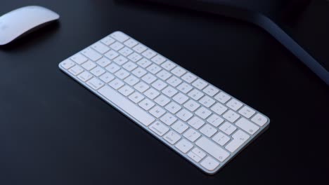 Male-hands-typing-on-a-white-wireless-keyboard