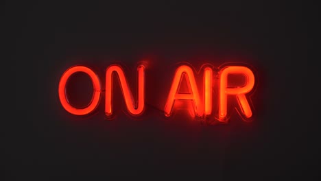 Red-on-air-sign-being-turned-on-and-being-turned-off