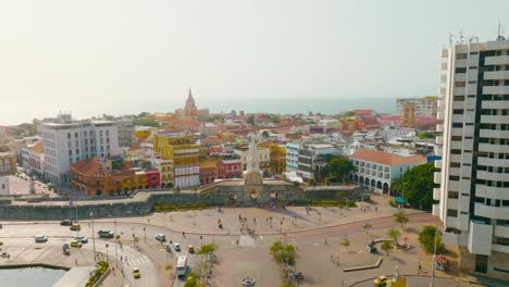 Aerial-drone-shot-of-the-Walled-City-of-Cartagena-entrance,-clock-tower,-Colombia
