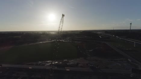 High-drone-shot-of-crane-on-a-construction-site
