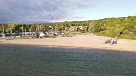 Sandy-beach-of-Suttons-Bay-in-Michigan,-aerial-drone-view