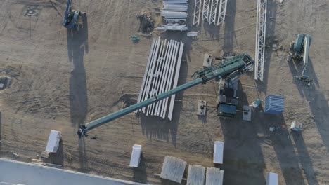 Drone-shot-of-a-crane-on-a-construction-site