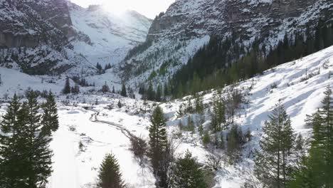 Aerial-Flying-Over-Snow-Covered-Valley-In-Marebbe,-South-Tyrol