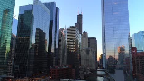 aerial-chicago-illinois-cinematic-conclusion-shot-pull-back-train-skyscrapers-urban
