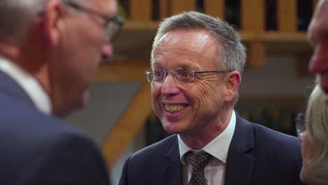 Commissioner-of-the-King-René-Paas-Talking-and-Smiling-to-Mayors-of-the-Province-Groningen,-Slow-Motion