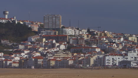 Town-buildings-by-the-beach-at-Nazare,-Portugal