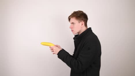 Man-using-a-banana-as-a-gun-looking-for-someone
