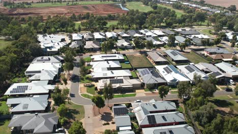 Yarrawonga,-Victoria,-Australia---31-January-2023:-Aerial-over-houses-heading-towards-the-golf-course-and-new-residential-stage-being-built