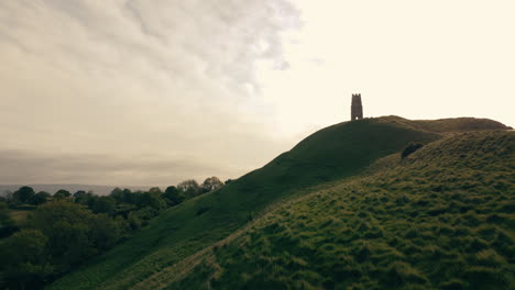 A-drone-shot-of-a-hill-in-Somerset-UK-called-Glastonbury-Tor