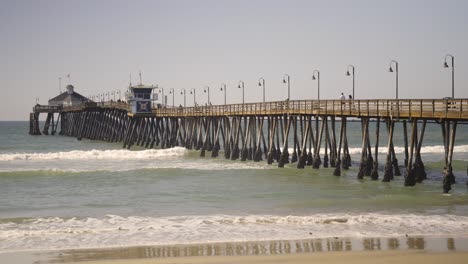 Imperial-Beach-Pier-in-Southern-California-with-waves-during-a-sunny-day