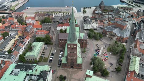 Aerial-of-Aarhus-Domkirke-Cathedral,-Denmark-Front-Facing