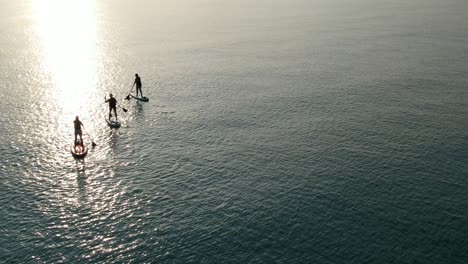 Woman-paddleboarding-at-sunrise-on-the-Gulf-of-Mexico