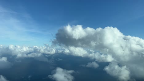 Flying-through-some-tiny-cumulus-clouds,-daylight