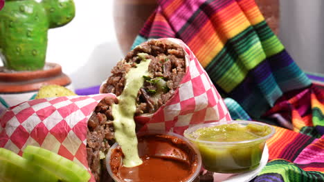 Squirting-guacamole-sauce-on-a-carne-asada-burrito---food-truck-series