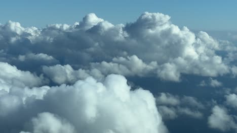 Flying-through-a-sky-with-some-tiny-cumulus-clouds
