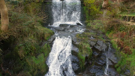 A-wide-shot-of-a-waterfall-in-the-British-countryside