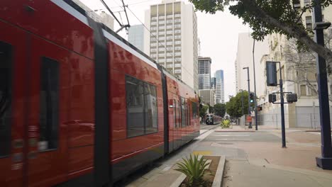 Slow-Motion-of-Trains-Passing-by-in-Urban-Downtown-San-Diego-California