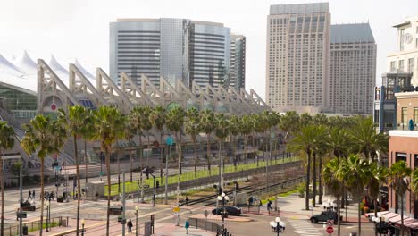 San-Diego-Convention-Center-on-a-sunny-day---Time-Lapse-of-Foot-Traffic,-Trains,-and-Cars