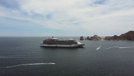Drone-shot-large-cruise-ship-sailing-in-ocean-for-tourists-travelling