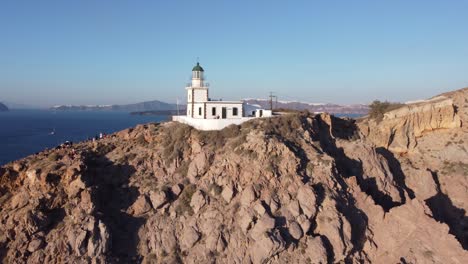 Aerial-Footage-Of-Lighthouse-In-Santorini,-Greece