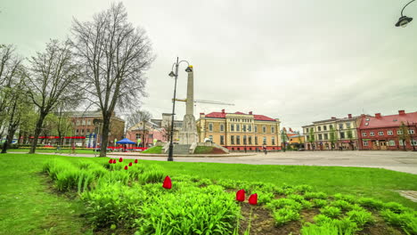 Cesis,-Latvia-town-square---spring-pull-back,-ascending-motion-time-lapse