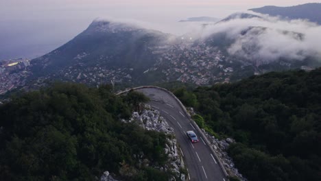 Old-vintage-car-driving-in-the-French-mountains-outside-Monaco