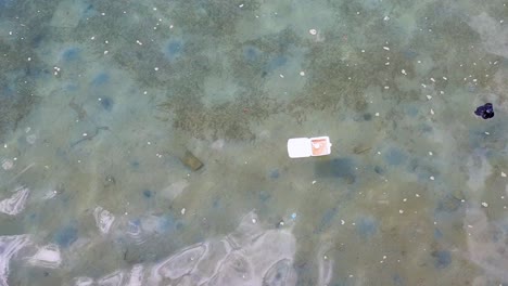 Plastic-pollution-in-ocean-caused-by-human-rubbish-and-waste,-floating-and-polluting-the-ocean-environment