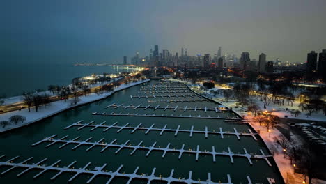 Aerial-view-over-the-empty-Diversey-Harbor,-gloomy-evening-in-snowy-Chicago,-USA