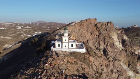 4K-Aerial-Drone-Flying-Over-Beautiful-Lighthouse-Santorini-Greece